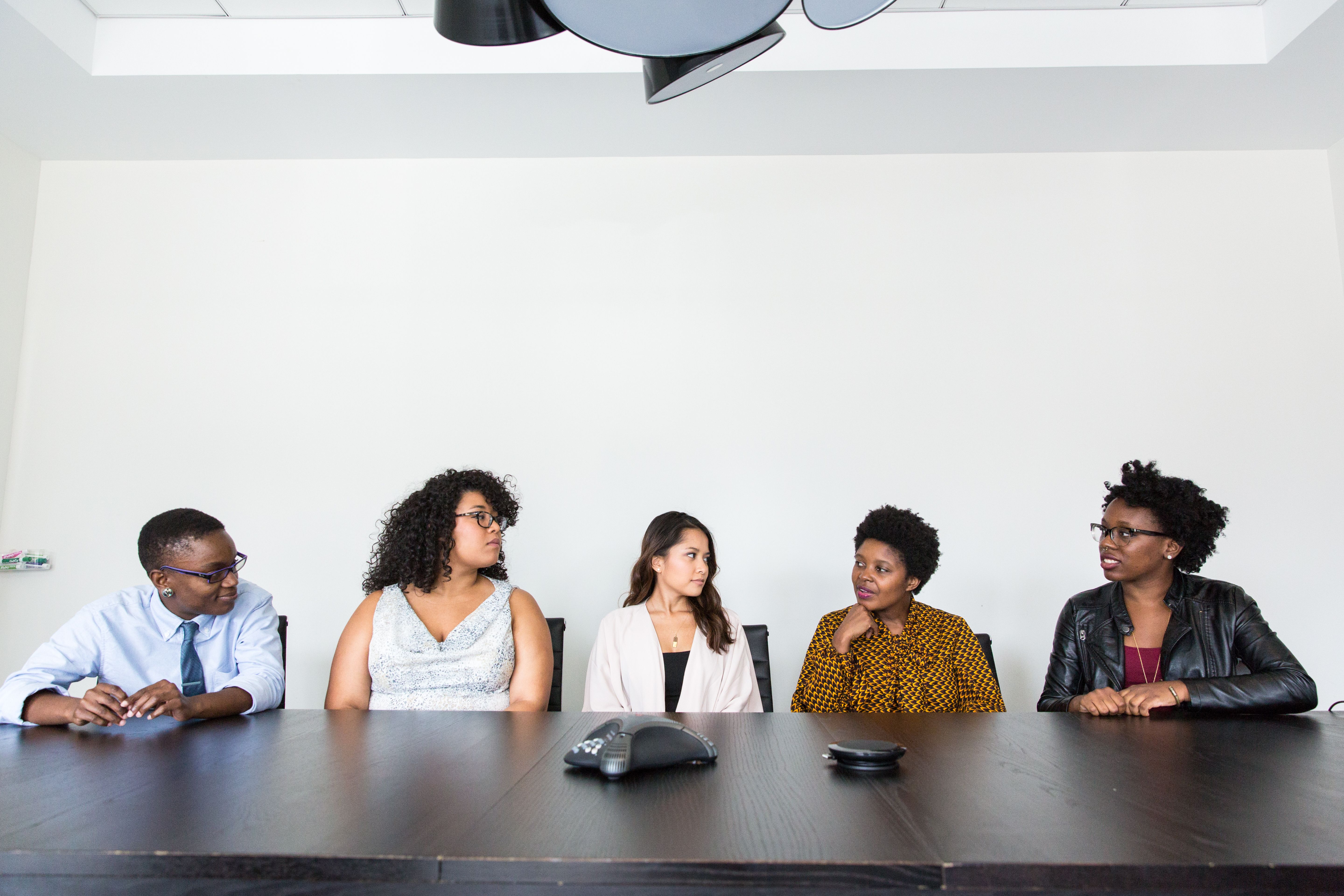 Team members in conversation at a table